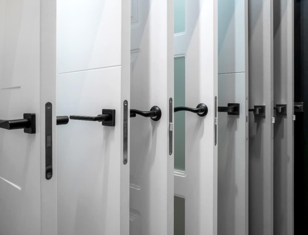 Door hardware components including hinges and locking mechanisms